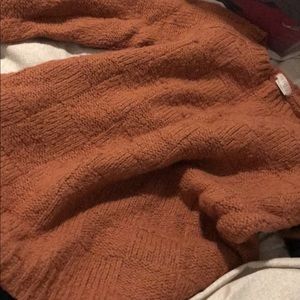 Burnt orange knit.